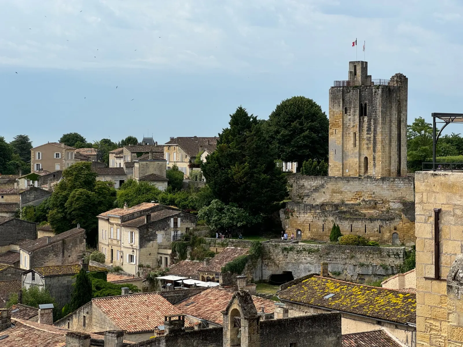 The medieval Tour du Roy keep rising over Saint-Émilion rooftops