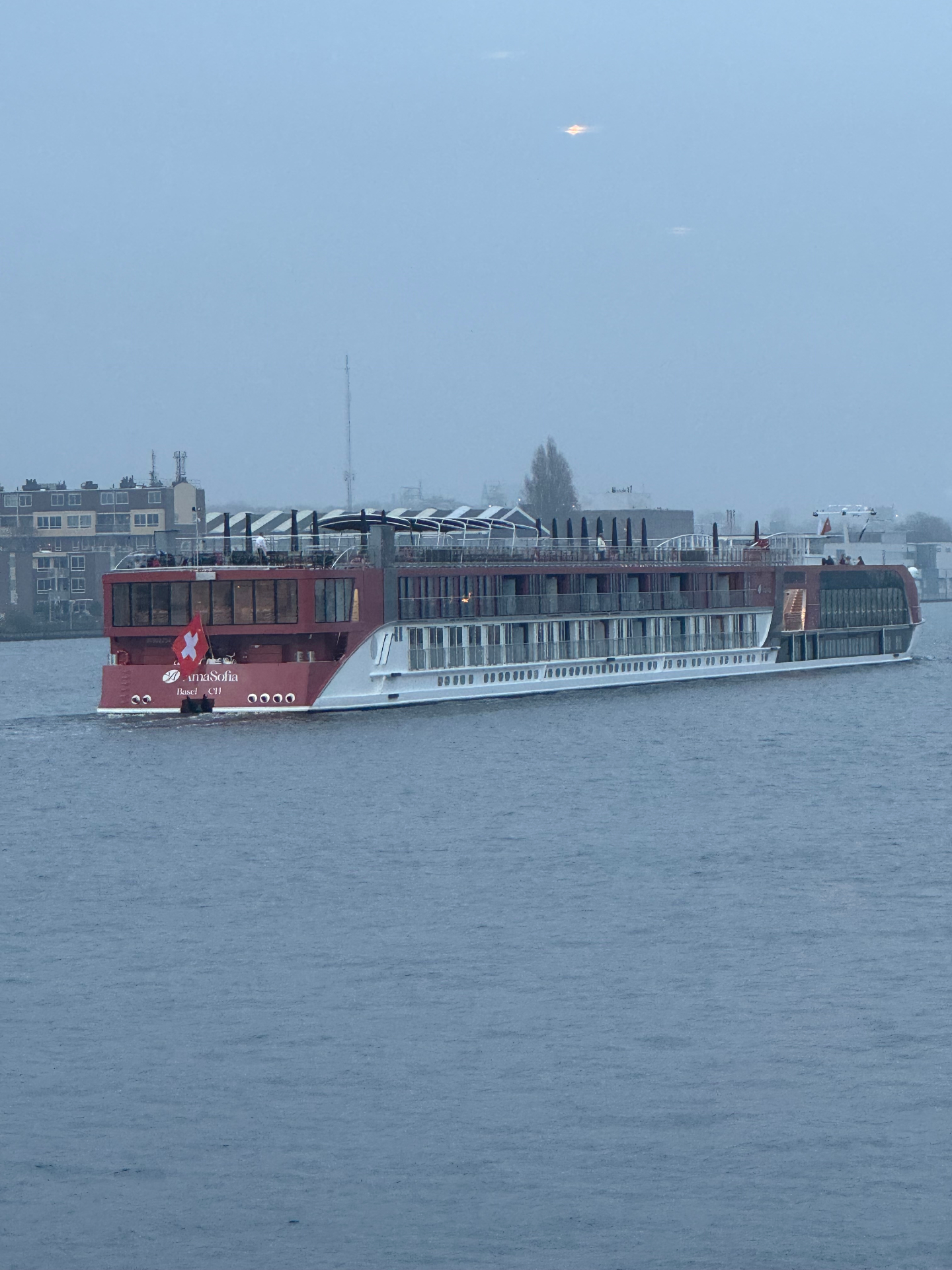 AmaWaterways AmaSofia sailing into Amsterdam at dusk