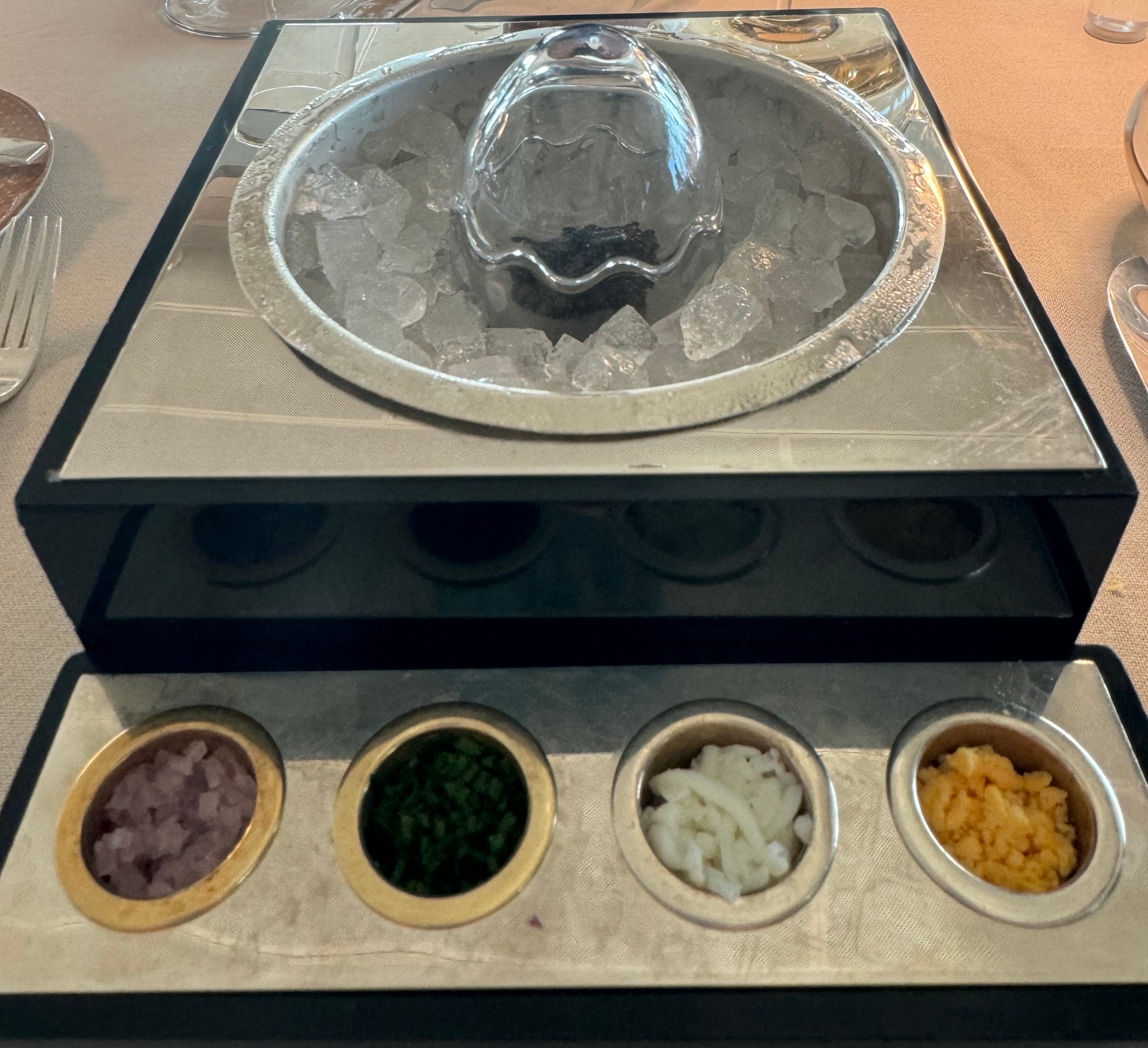 Silversea caviar service — chilled crystal bowl of Ars Italica caviar over ice with traditional accompaniments