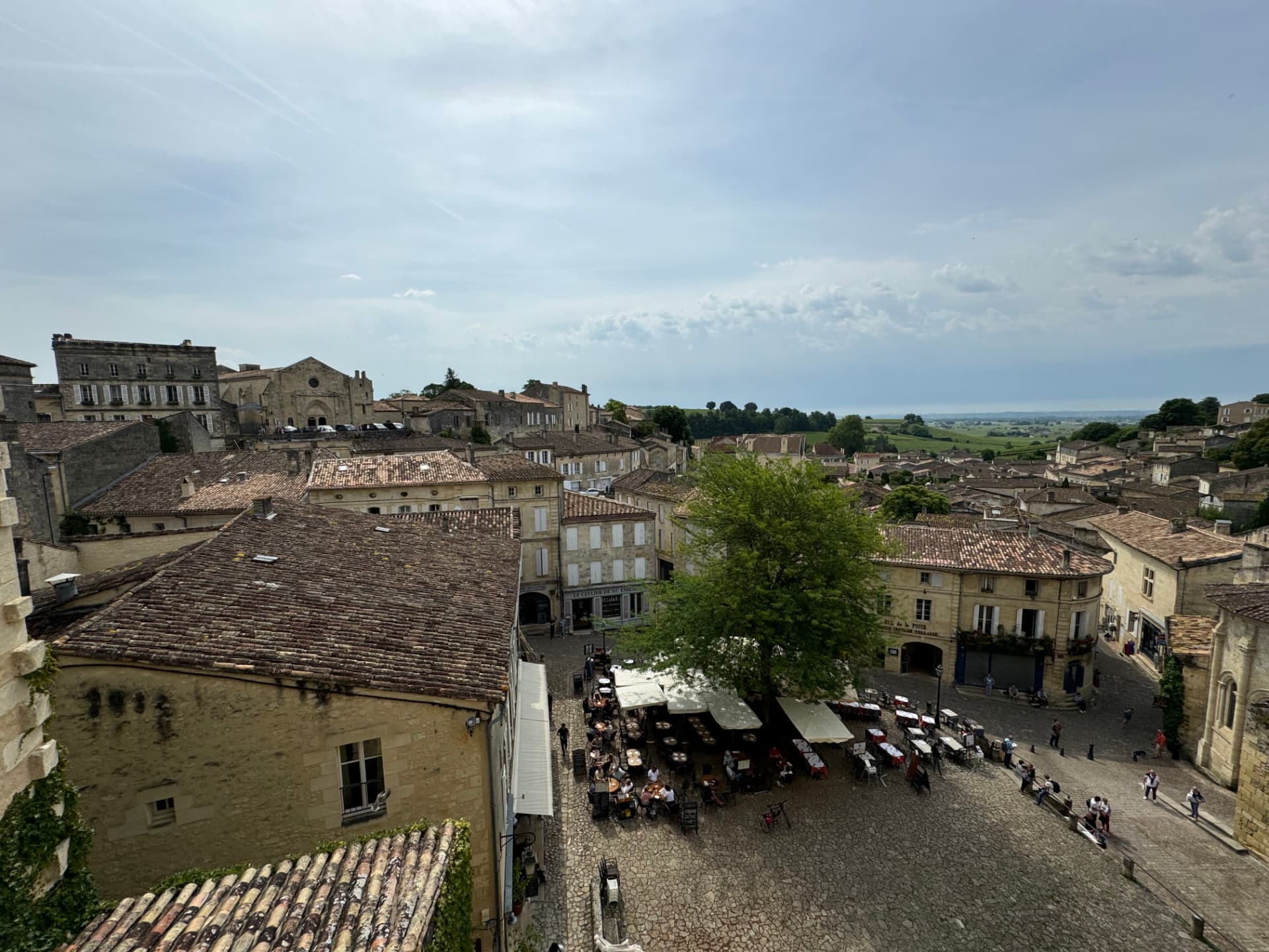 Café tables in the main square of Saint-Émilion seen from above