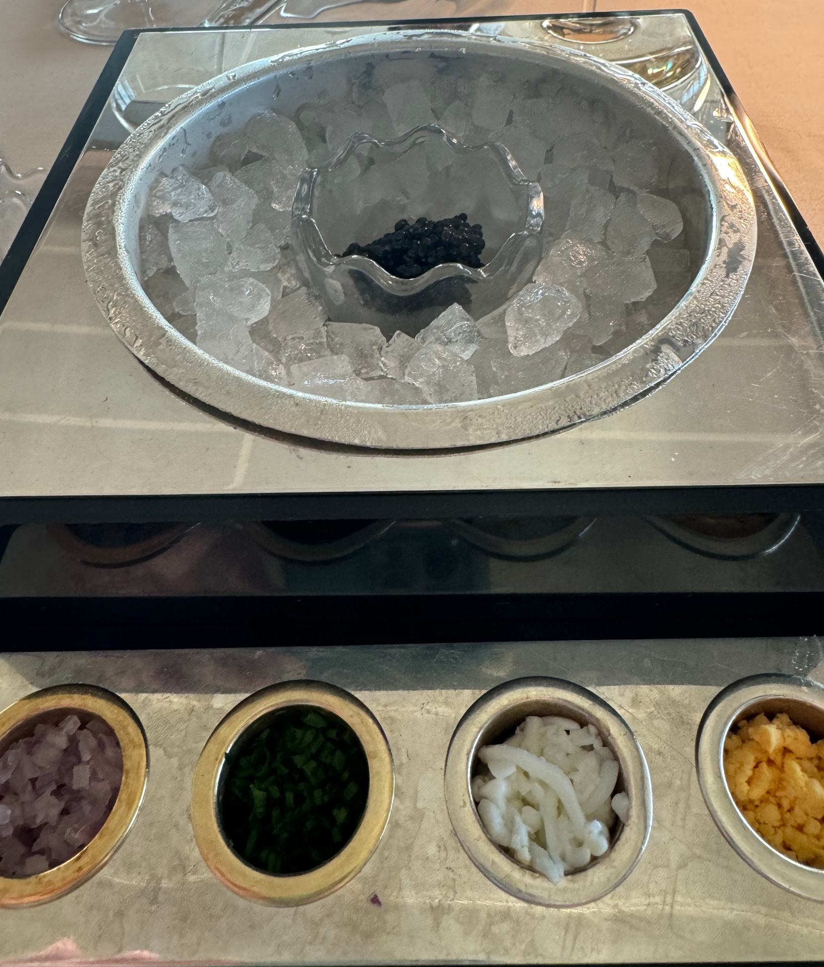 Close-up of Silversea's Ars Italica caviar presentation with a crystal serving vessel nested in ice
