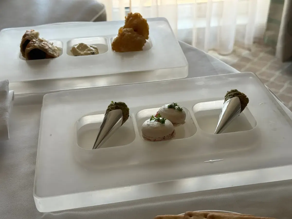 Butler-served canapés on frosted acrylic trays