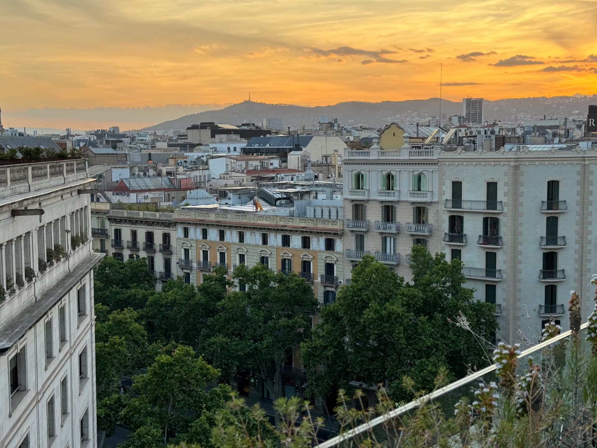 Sunset over Barcelona rooftops before embarkation