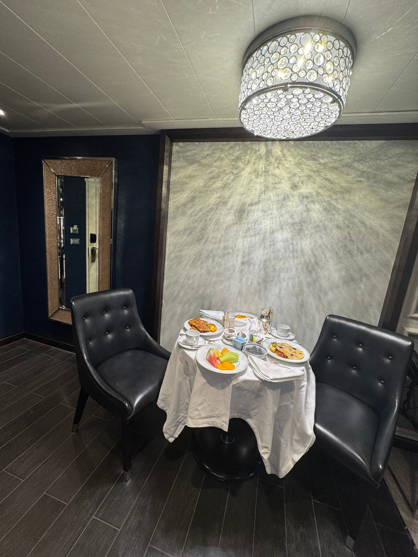 In-suite breakfast service aboard a luxury cruise