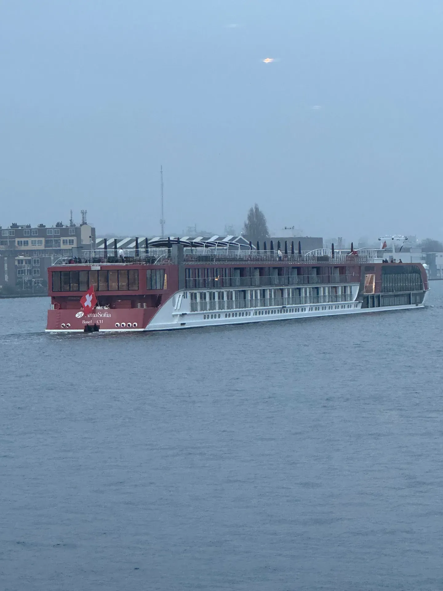 AmaWaterways AmaSofia sailing into Amsterdam at dusk