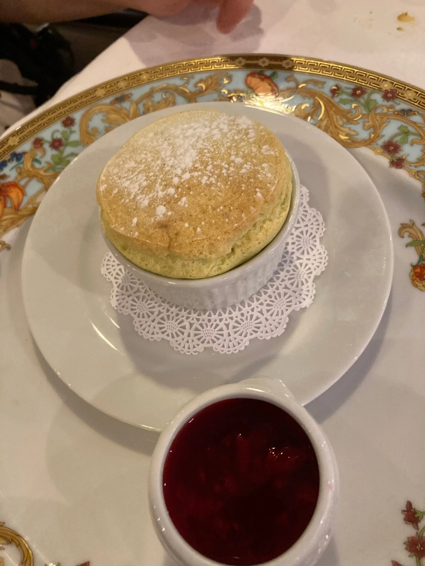 Grand Marnier soufflé served in fine Versace china at Jacques