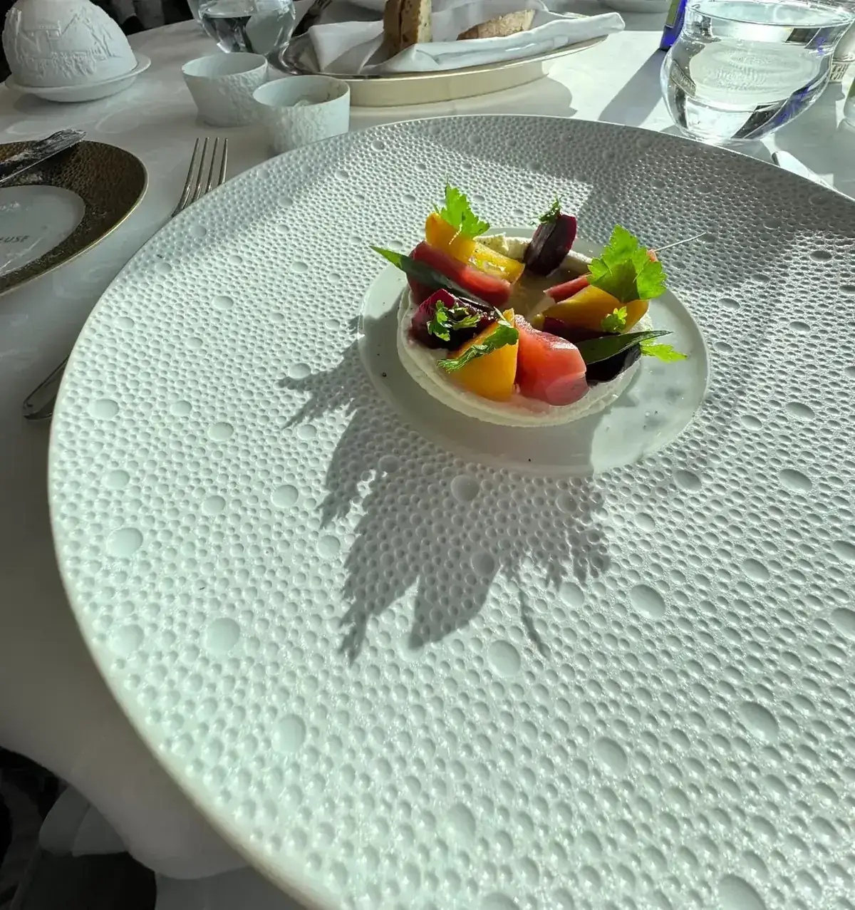 Heirloom beet and goat cheese starter plated at Chartreuse on Regent Seven Seas