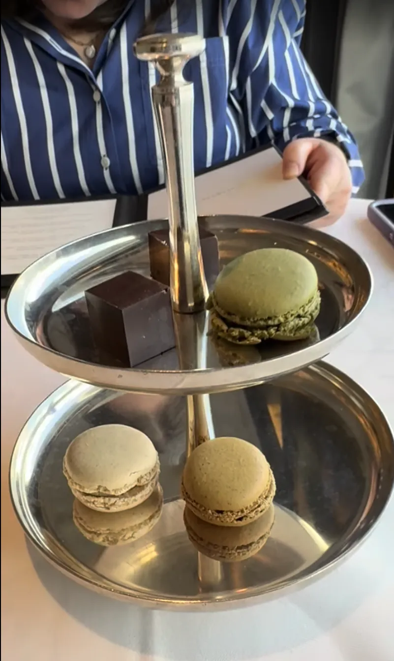 Tiered tray of macarons and chocolates selected from the Chartreuse dessert cart