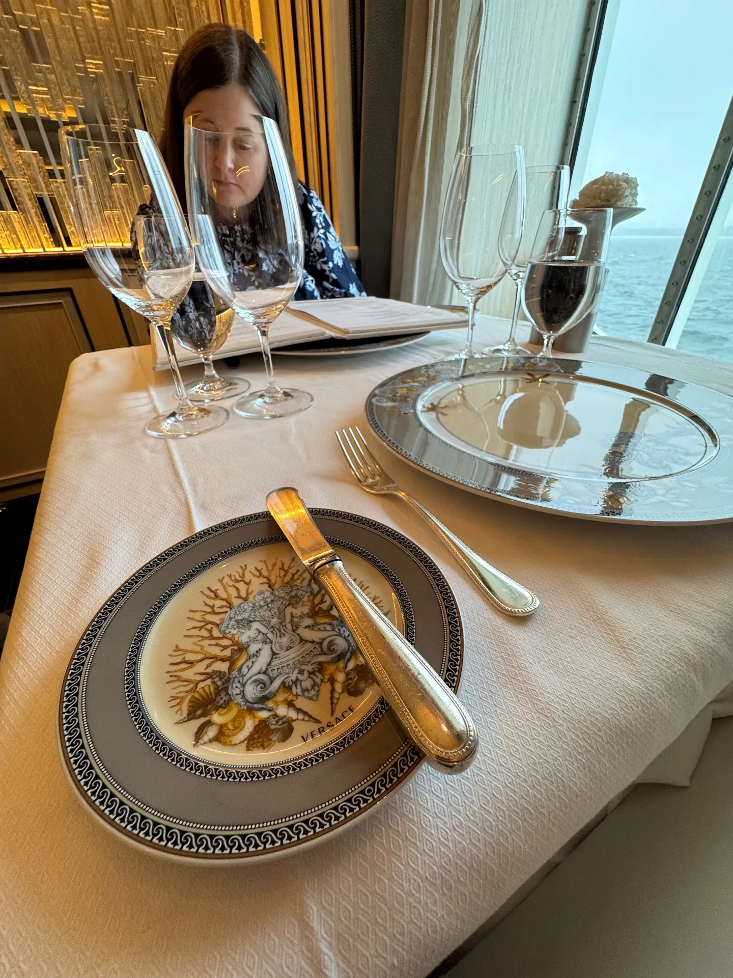 Compass Rose table setting with Versace china and ocean views aboard Regent Seven Seas