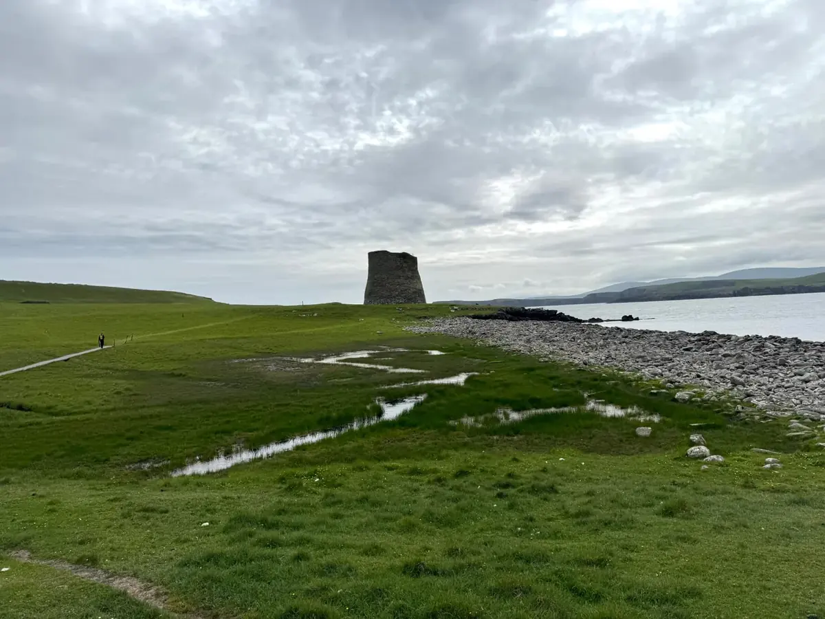 The Iron Age broch on Mousa Island, Shetland, above a rocky shoreline