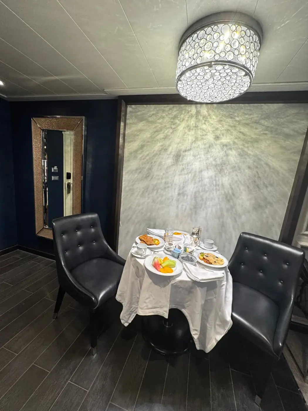 A table set with linen for room service breakfast in a Regent Penthouse suite