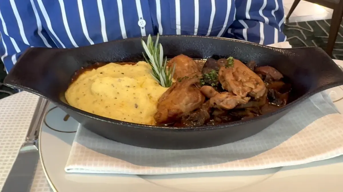 Braised chicken with mushrooms served over polenta at Sette Mari