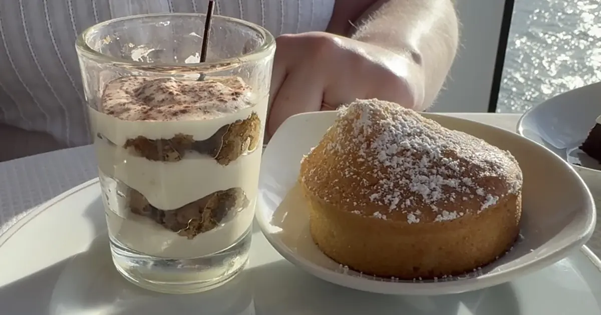 Tiramisu in a glass next to a warm cake at the Sette Mari dessert buffet