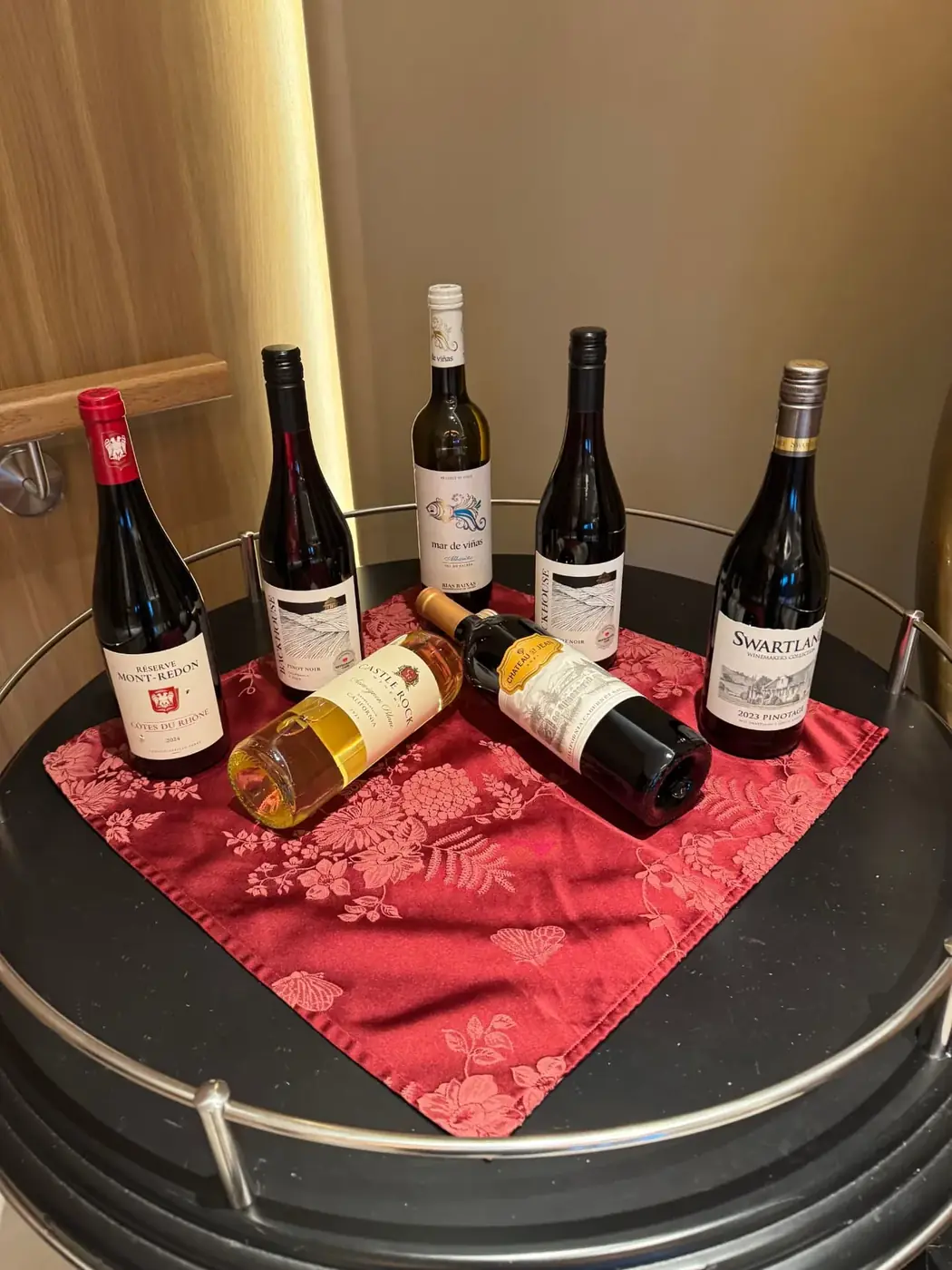 A selection of red and white wine bottles delivered to a Regent suite