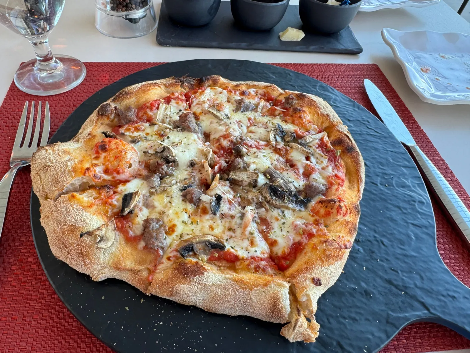 Wood-fired mushroom and sausage pizza at Silversea's poolside Italian venue