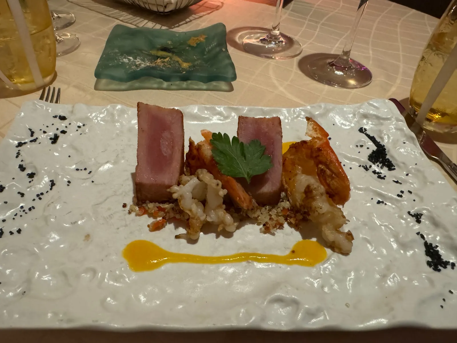 Seared tuna, shrimp and calamari quinoa plate at a Silversea specialty restaurant
